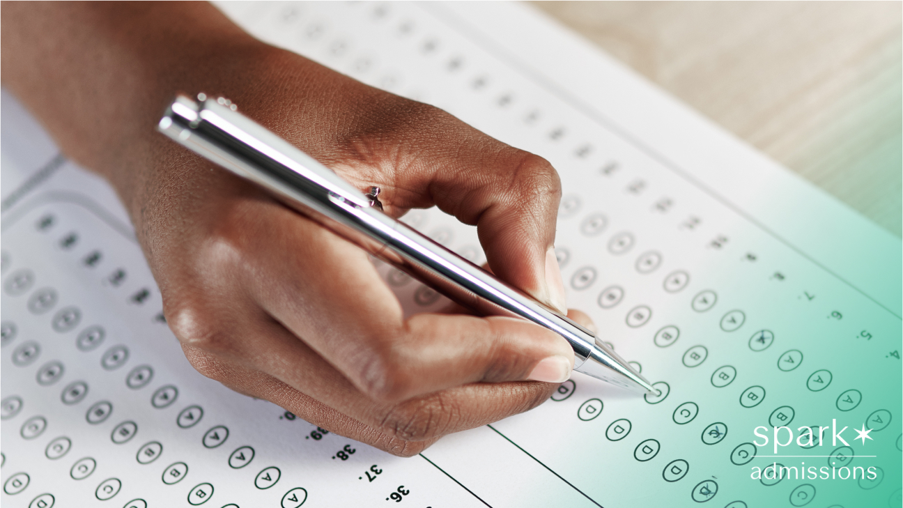 Close-up of a student filling in answers on a standardized test sheet with a pen